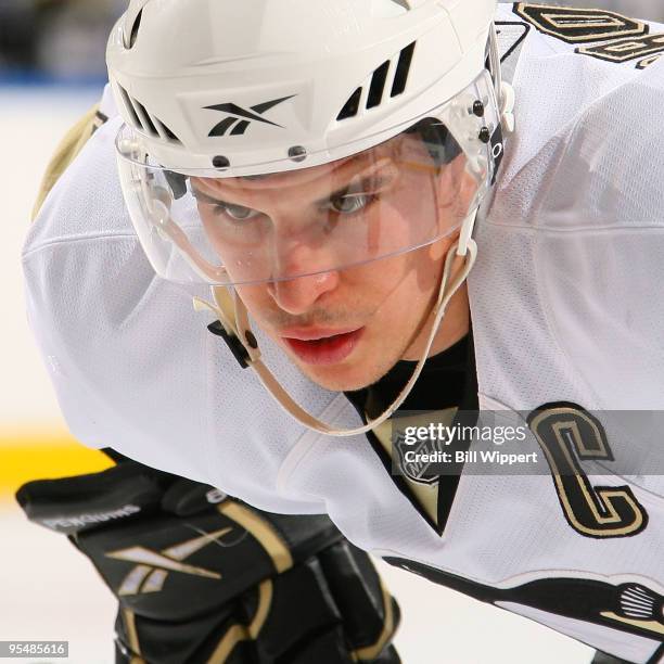 Sidney Crosby of the Pittsburgh Penguins concentrates before taking a faceoff against the Buffalo Sabres on December 29, 2009 at HSBC Arena in...