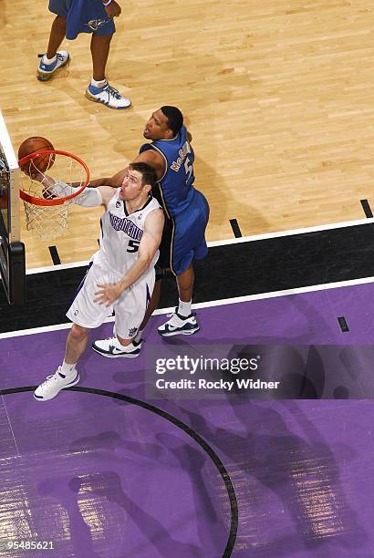 Andres Nocioni of the Sacramento Kings shoots a layup against Dominic McGuire of the Washington Wizards during the game at Arco Arena on December 16,...