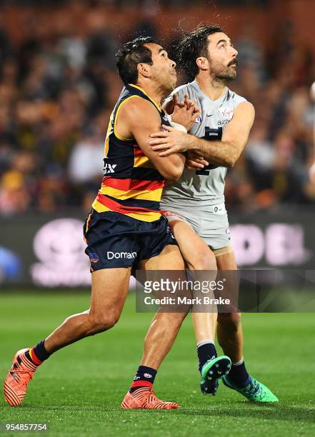Eddie Betts of the Adelaide Crows and Kade Simpson of the Blues during the round seven AFL match between the Adelaide Crows and the Carlton Blues at...