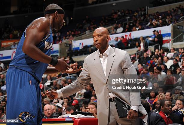 Brendan Haywood and assistant coach Sam Cassell of the Washington Wizards talk during the game against the Los Angeles Clippers at Staples Center on...