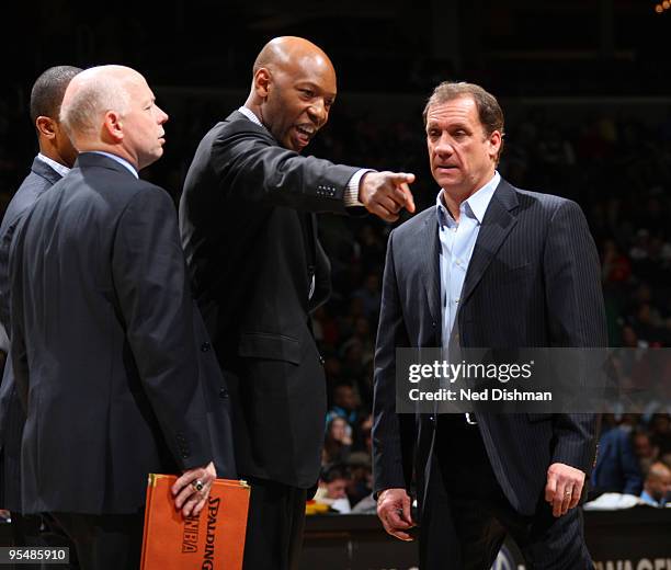 Assistant coach Sam Cassell and head coach Flip Saunders of the Washington Wizards talk strategy during a time out against the Oklahoma City Thunder...