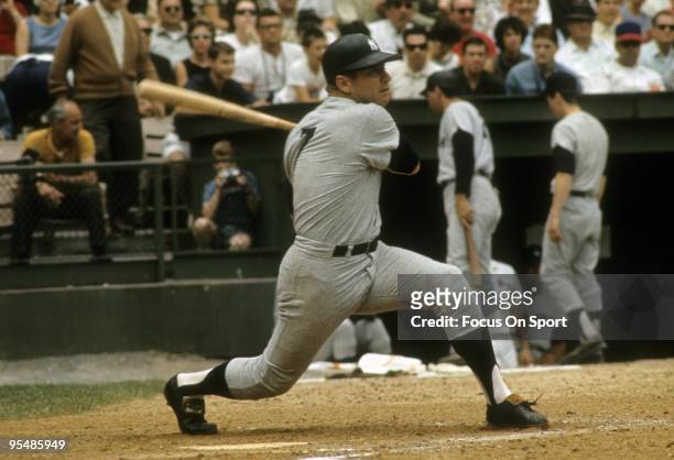 Outfielder Mickey Mantle of the New York Yankees swings and watches the flight of his ball during a circa 1960's Major League Baseball game. Mantle...