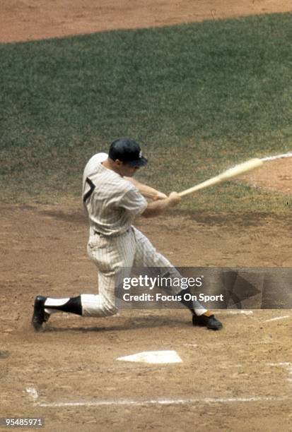 S: Outfielder Mickey Mantle of the New York Yankees swings and watches the flight of his ball during a circa 1960's Major League Baseball game at...