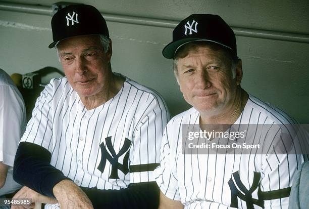 S: Outfielder Mickey Mantle formally of the New York Yankees sits in the dougout with ex teammate Joe Dimaggio during a circa 1980's Old timers game...