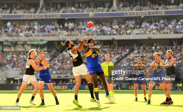 Nic Naitanui of the Eagles contests a boundary throw in against Paddy Ryder of the Power during the 2018 AFL round seven match between the West Coast...