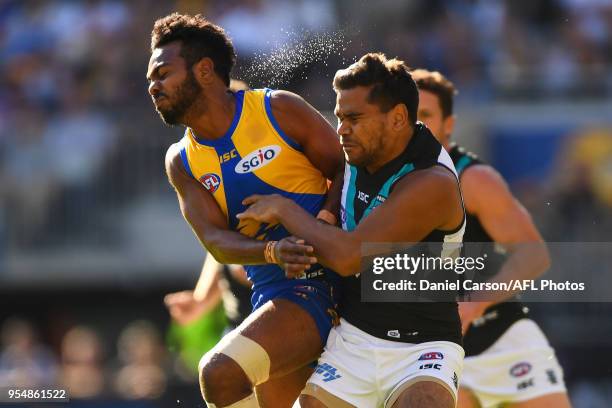 Willie Rioli of the Eagles clashes with Jake Neade of the Power during the 2018 AFL round seven match between the West Coast Eagles and the Port...