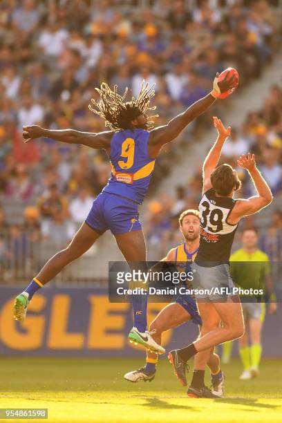 Nic Naitanui of the Eagles contests a ruck with Justin Westhoff of the Power during the 2018 AFL round seven match between the West Coast Eagles and...