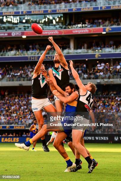 Jack Hombsch of the Power spoils in the marking contest during the 2018 AFL round seven match between the West Coast Eagles and the Port Adelaide...