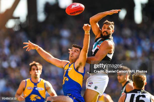 Paddy Ryder of the Power is tackled by Scott Lycett of the Eagles during the 2018 AFL round seven match between the West Coast Eagles and the Port...