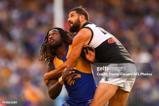 Nic Naitanui of the Eagles contests a boundary throw in against Paddy Ryder of the Powerv during the 2018 AFL round seven match between the West...