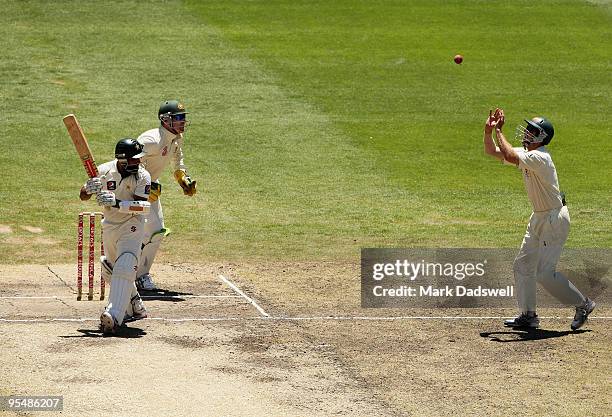 Mohammad Yousuf of Pakistan and Brad Haddin of Australia watch as the ball sits up for Simon Katich to take an easy catch off the bowling of Nathan...