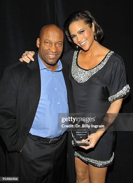 Exclusive Coverage*** Actress Paula Patton and director John Singleton pose backstage at the 2009 African American Critics Association Awards at The...