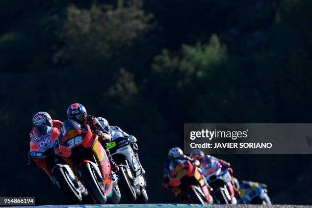 Ducati Team's Italian rider Andrea Dovizioso , Red Bull KTM Factory Racing's British rider Bradley Smith and Pull and Bear Aspar Team's Spanish rider...