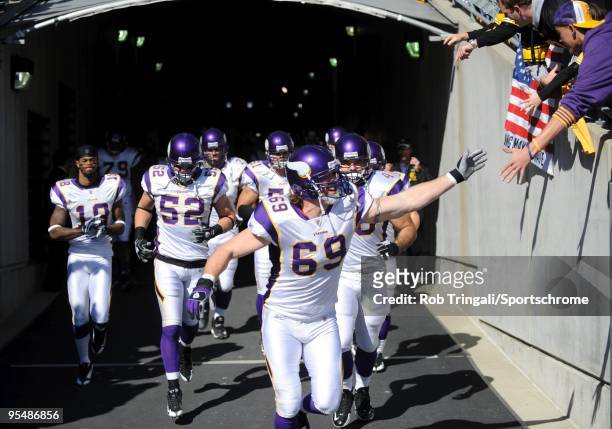 Jared Allen and Minnesota Vikings walk through the tunnel for introductions before the game against the Pittsburgh Steelers at Heinz Field on October...