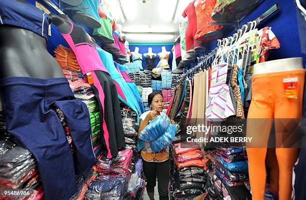 By Stephen Coates A vendor manages her shop in Jakarta on December 30, 2009. China and Southeast Asia establish the world's biggest free trade area ,...