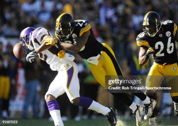 Percy Harvin of the Minnesota Vikings attempts to make a catch as Ryan Clark of the Pittsburgh Steelers defends at Heinz Field on October 25, 2009 in...