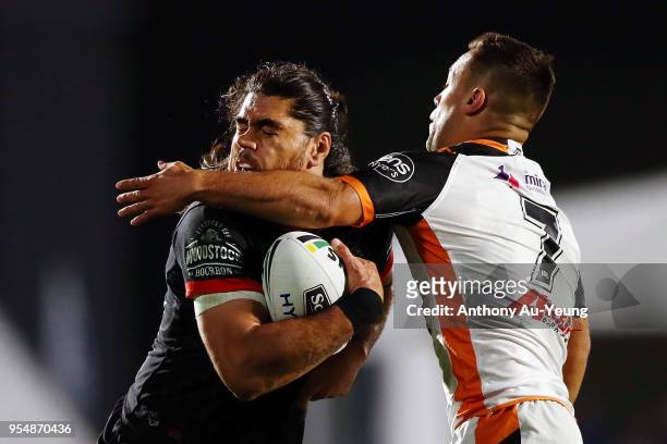 Tohu Harris of the Warriors is tackled Luke Brooks of the Tigers during the round nine NRL match between the New Zealand Warriors and the Wests...
