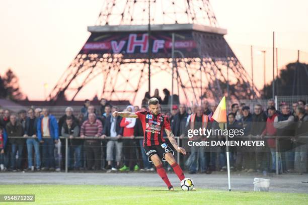 Les Herbiers' defender Adrien Pagerie kicks the ball with a a 32 meters high Eiffel Tower replica as background during the French National 1 football...