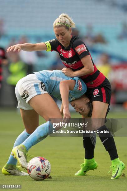 Erica Halloway of the Western Sydney Wanderers gets tangled up in this challenge with City's Alanna Kennedy during the round nine W-League match...