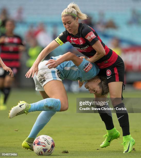 Erica Halloway of the Western Sydney Wanderers gets tangled up in this challenge with City's Alanna Kennedy during the round nine W-League match...