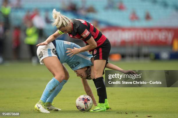 Erica Halloway of the Western Sydney Wanderers gets tangled up in this challenge with City's Alanna Kennedy during the round nine W-League match...