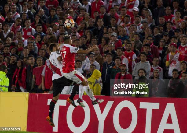 Marcelo Josemir Saracchi of River Plate vies for the ball with Colombia's Independiente Santa Fe player Juan Daniel Roa during their 2018 Copa...