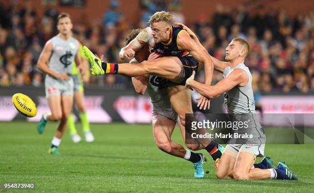 Hugh Greenwood of the Adelaide Crows breaks away from Liam Jones of the Blues during the round seven AFL match between the Adelaide Crows and the...