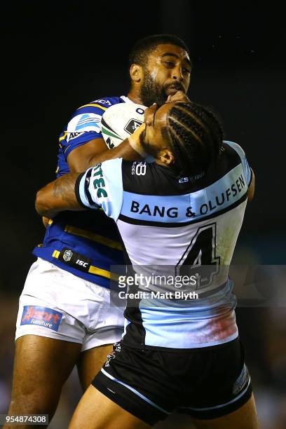 Michael Jennings of the Eels is tackled by Ricky Leutele of the Sharks during the round nine NRL match between the Cronulla Sharks and the Parramatta...