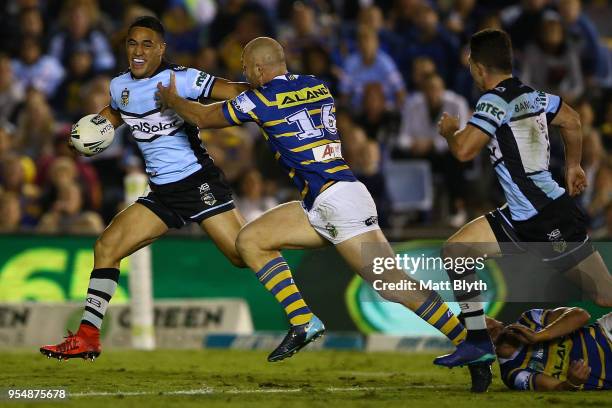 Valentine Holmes of the Sharks makes a break during the round nine NRL match between the Cronulla Sharks and the Parramatta Eels at Southern Cross...