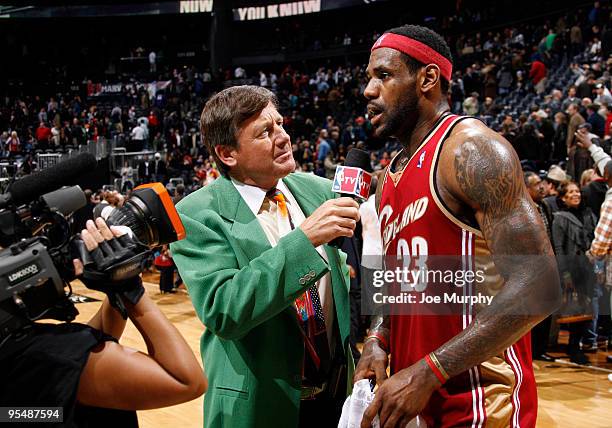 Craig Sager, broadcaster for NBA TV, interviews LeBron James of the Cleveland Cavaliers after a win against the Atlanta Hawks on December 29, 2009 at...