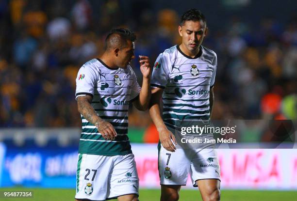 Javier Cortes and Jesus Isijara of Santos talkduring the quarter finals first leg match between Tigres UANL and Santos Laguna as part of the Torneo...