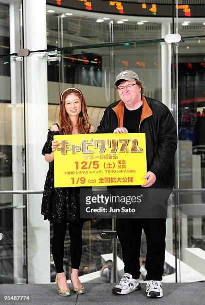 Actress Yuko Ogura and director Michael Moore attend "Capitalism: A Love Story" Press Conference at Tokyo Stock Exchange on November 30, 2009 in...