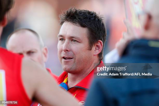 Stuart Dew, Senior Coach of the Suns addresses his players during the 2018 AFL round seven match between the Western Bulldogs and the Gold Coast Suns...