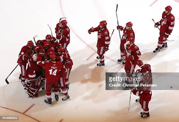 Goaltender Jason LaBarbera of the Phoenix Coyotes is congratulated by teammates after defeating the Vancouver Canucks in the NHL game at Jobing.com...