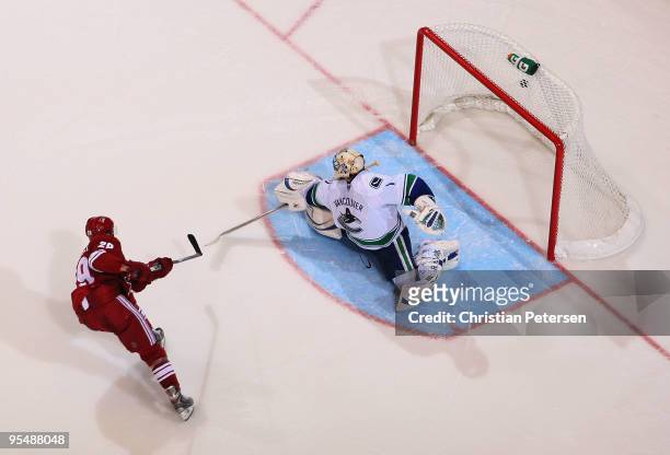 Lauri Korpikoski of the Phoenix Coyotes scores a shootout goal past goaltender Roberto Luongo of the Vancouver Canucks during the NHL game at...