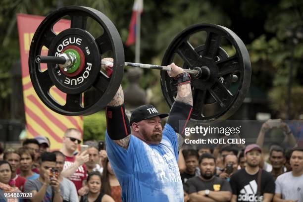 Hafthor Julius Bjornsson of Iceland lifts weights during the Max Overhead competition of the 2018 Worlds Strongest Man in Manila on May 5, 2018. /...