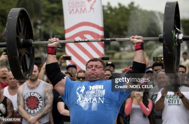 Zydrunas Savickas of Lithuania lifts weights as he participates in the Max Overhead competition of the 2018 Worlds Strongest Man in Manila on May 5,...