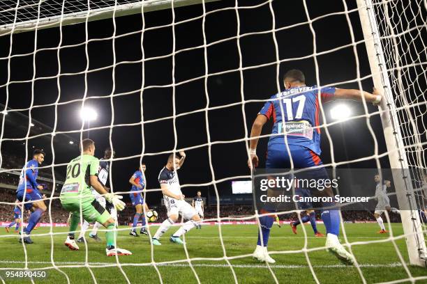 Kosta Barbarouses of the Victory scores a goal past goalkeeper Glen Moss of the Jets during the 2018 A-League Grand Final match between the Newcastle...