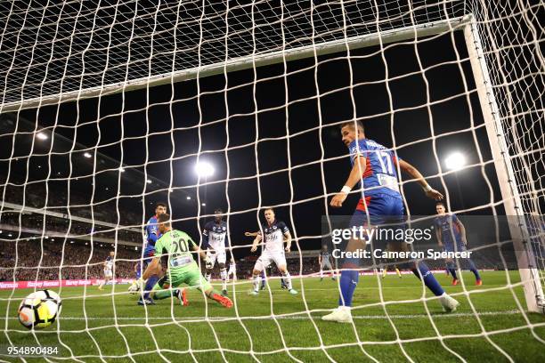 Kosta Barbarouses of the Victory scores a goal past goalkeeper Glen Moss of the Jets during the 2018 A-League Grand Final match between the Newcastle...