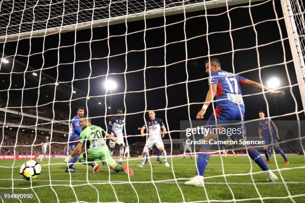 Kosta Barbarouses of the Victory scores a goal past goalkeeper Glen Moss of the Jets during the 2018 A-League Grand Final match between the Newcastle...