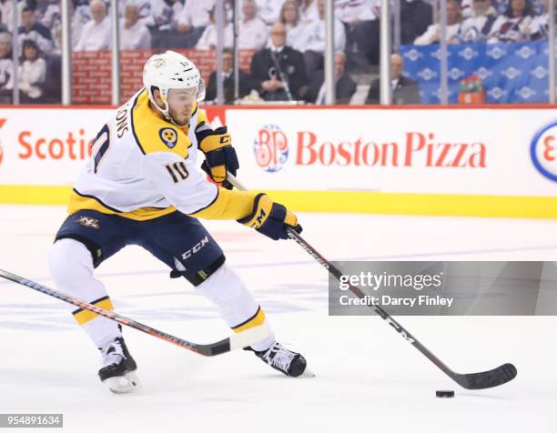 Colton Sissons of the Nashville Predators plays the puck down the ice during second period action against the Winnipeg Jets in Game Three of the...