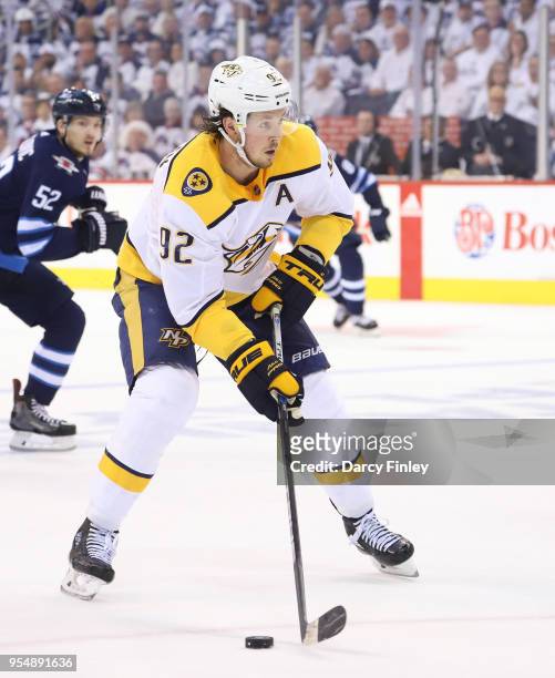 Ryan Johansen of the Nashville Predators plays the puck down the ice during second period action against the Winnipeg Jets in Game Three of the...