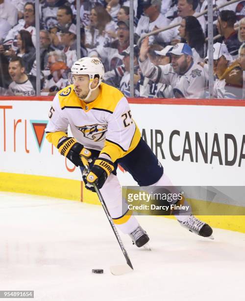 Alexei Emelin of the Nashville Predators plays the puck around the boards during third period action against the Winnipeg Jets in Game Three of the...