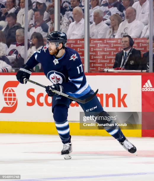 Adam Lowry of the Winnipeg Jets keeps an eye on the play during first period action against the Nashville Predators in Game Three of the Western...