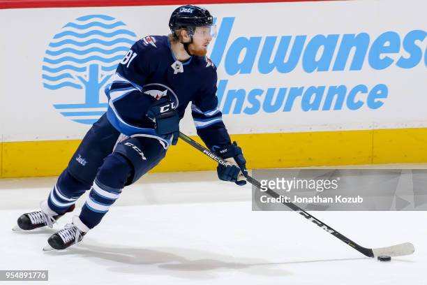 Kyle Connor of the Winnipeg Jets plays the puck during second period action against the Nashville Predators in Game Three of the Western Conference...