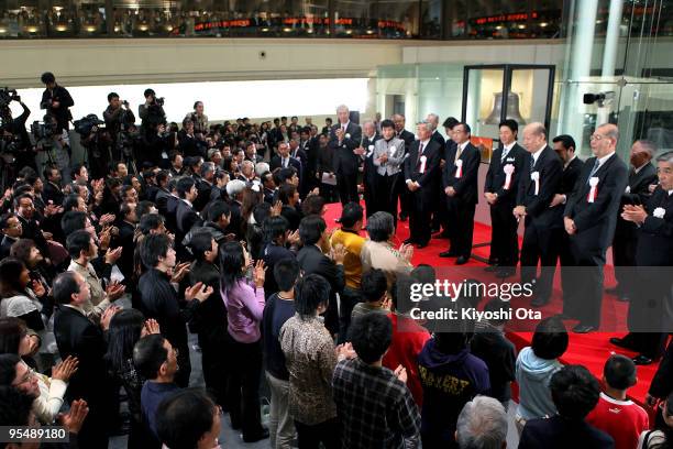 Visitors and representatives from securities firms attend the closing ceremony to mark the end of the year's trading at the Tokyo Stock Exchange on...