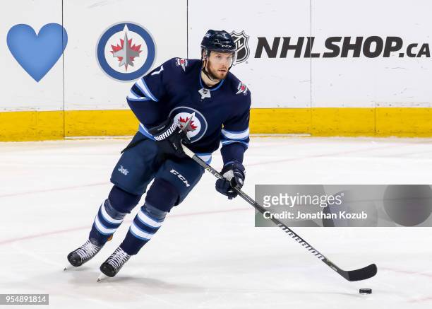 Ben Chiarot of the Winnipeg Jets plays the puck up the ice during third period action against the Nashville Predators in Game Three of the Western...