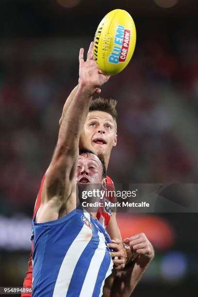 Callum Sinclair of the Swans and Todd Goldstein of the Kangaroos compete for the ball during the round seven AFL match between the Sydney Swans and...