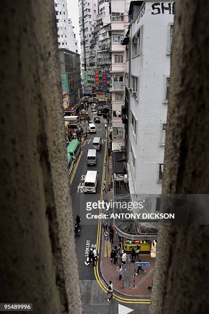 HongKong-crime-acid-society,FOCUS by Peter Brieger Pedestrians are seen from a ventilation window at a residential building in Hong Kong's shopping...