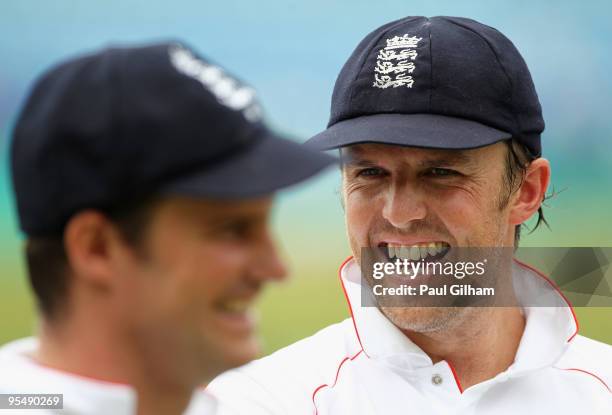 Graeme Swann of England shares a joke with captain Andrew Strauss following England's victory over South Africa by an innings and 98 runs during day...